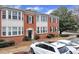Brick townhouse featuring black shutters and well maintained landscaping at 2345 Henderson Mill Ne Rd # 1, Atlanta, GA 30345