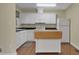 Well-appointed kitchen with white cabinetry, stainless steel appliances, and functional island at 2345 Henderson Mill Ne Rd # 1, Atlanta, GA 30345