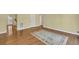 Living room with wood flooring, white trim and neutral wall color at 2345 Henderson Mill Ne Rd # 1, Atlanta, GA 30345