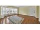 Spacious living room with bright bay windows and hardwood floors at 2345 Henderson Mill Ne Rd # 1, Atlanta, GA 30345