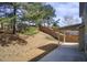 View of backyard landscaping and covered patio area in backyard at 3483 Summerlin Pkwy, Lithia Springs, GA 30122