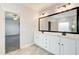 Bright bathroom boasting a double sink vanity with marble countertops and ample storage at 3483 Summerlin Pkwy, Lithia Springs, GA 30122