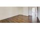 Bedroom featuring hardwood floors, white walls, and a window for natural light at 3483 Summerlin Pkwy, Lithia Springs, GA 30122
