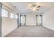 Spacious bedroom featuring neutral carpeting, a ceiling fan, and plenty of natural light at 3483 Summerlin Pkwy, Lithia Springs, GA 30122