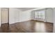 Bonus room featuring hardwood floors, a window and doors and versatile space at 3483 Summerlin Pkwy, Lithia Springs, GA 30122