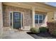 Close-up of front door with decorative brickwork and manicured landscaping at 3483 Summerlin Pkwy, Lithia Springs, GA 30122