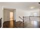Hallway with hardwood floors, white walls, and white trim at 3483 Summerlin Pkwy, Lithia Springs, GA 30122
