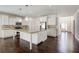 Open kitchen with granite island, stainless appliances, and white cabinetry at 3483 Summerlin Pkwy, Lithia Springs, GA 30122