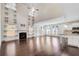 Open-concept living room with hardwood floors, soaring ceilings, and a cozy fireplace at 3483 Summerlin Pkwy, Lithia Springs, GA 30122