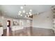 Open floor plan connecting kitchen and living room with modern light fixture at 3483 Summerlin Pkwy, Lithia Springs, GA 30122