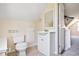 Half bathroom featuring a modern vanity with storage, tile floors, and a neutral color palette at 45 Buckeye Cir, Covington, GA 30016