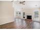 Open living room with a fireplace and tons of natural light at 45 Buckeye Cir, Covington, GA 30016