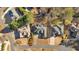 Aerial view of three well-kept homes, showcasing their driveways and landscaping at 2021 Cockrell Pointe Nw, Kennesaw, GA 30152