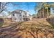 The exterior of the home is showcased with the expansive backyard at 2021 Cockrell Pointe Nw, Kennesaw, GA 30152