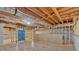 Partially finished basement with wooden framing and exposed ceiling at 2021 Cockrell Pointe Nw, Kennesaw, GA 30152