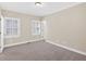 Bright bedroom with plush carpet, shuttered windows, and ample natural light at 2021 Cockrell Pointe Nw, Kennesaw, GA 30152