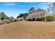 Well-maintained lawn enhances the curb appeal of this attractive home at 2021 Cockrell Pointe Nw, Kennesaw, GA 30152