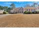 Brick home with immaculate lawn has a two-car garage and traditional design at 2021 Cockrell Pointe Nw, Kennesaw, GA 30152