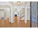 Welcoming foyer with hardwood floors, chandelier, and a view into the spacious living area at 2021 Cockrell Pointe Nw, Kennesaw, GA 30152