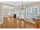 Open floorplan shows the kitchen and living room with a fireplace and shuttered windows at 2021 Cockrell Pointe Nw, Kennesaw, GA 30152