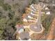 An aerial image showcases a home within a wooded neighborhood with mature trees and maintained lawns at 2099 Easterwood Ter, Decatur, GA 30032