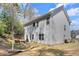 A well maintained backyard features gray siding, ample windows, and an outdoor seating area at 2099 Easterwood Ter, Decatur, GA 30032