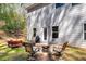 Outdoor patio featuring a cozy seating area, grill, and fire pit overlooking the well maintained backyard at 2099 Easterwood Ter, Decatur, GA 30032