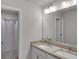 Bathroom with dual sinks, granite countertops, and a shower at 2099 Easterwood Ter, Decatur, GA 30032