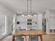 Dining area with modern light fixture, table and view of kitchen at 2099 Easterwood Ter, Decatur, GA 30032