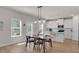 Dining area with modern light fixture, table and view of kitchen and back door at 2099 Easterwood Ter, Decatur, GA 30032
