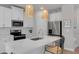 Bright, modern kitchen with stainless steel appliances, white cabinets, and eat-in island at 2099 Easterwood Ter, Decatur, GA 30032