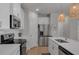 Bright, modern kitchen with stainless steel appliances, white cabinets, and eat-in island at 2099 Easterwood Ter, Decatur, GA 30032