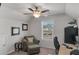 An office featuring a ceiling fan, a chair and desk setup, as well as natural light from the window at 2099 Easterwood Ter, Decatur, GA 30032
