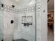 Modern shower featuring elegant tile work, a built-in niche, and sleek fixtures, creating a spa-like experience at 120 Mill Creek Ct, Acworth, GA 30101