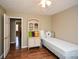Cozy bedroom featuring wood floors and a comfortable mattress on a bed frame at 120 Mill Creek Ct, Acworth, GA 30101