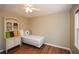 Cozy bedroom with hardwood floors and ample natural light with a twin bed at 120 Mill Creek Ct, Acworth, GA 30101