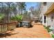 Expansive wooden deck featuring a luxurious hot tub, providing the perfect space for relaxation and outdoor entertainment at 120 Mill Creek Ct, Acworth, GA 30101