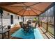 Outdoor deck with covered dining, perfect for entertaining with forest views at 120 Mill Creek Ct, Acworth, GA 30101