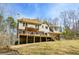 Back of home, showcasing the multi-level deck and backyard, perfect for outdoor living and entertaining at 120 Mill Creek Ct, Acworth, GA 30101