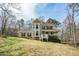 Charming two-story home featuring a welcoming front porch and well-maintained landscaping nestled in a serene wooded setting at 120 Mill Creek Ct, Acworth, GA 30101