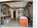 Well-organized garage with storage shelves, tools, and ample space for parking at 120 Mill Creek Ct, Acworth, GA 30101