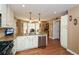 Bright and airy kitchen featuring stainless steel appliances, granite countertops, and hardwood floors at 120 Mill Creek Ct, Acworth, GA 30101