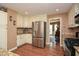 Well-lit kitchen with stainless steel appliances, granite countertops, and wood flooring at 120 Mill Creek Ct, Acworth, GA 30101