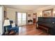 Cozy living room featuring hardwood floors, a large window, and elegant furnishings, perfect for relaxation at 120 Mill Creek Ct, Acworth, GA 30101