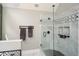 Modern shower with glass enclosure, sleek fixtures, decorative tile accent, and tiled shower niche at 120 Mill Creek Ct, Acworth, GA 30101