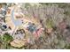 Expansive aerial view of the property showing its large lot, mature trees, and proximity to neighborhood amenities at 1765 Dew Pl, Marietta, GA 30064