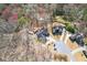 Aerial view showcases the house surrounded by dense trees at 1765 Dew Pl, Marietta, GA 30064
