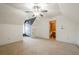 Open bonus room with neutral carpet, bathroom access, and a stylish chalkboard accent wall at 1765 Dew Pl, Marietta, GA 30064