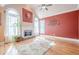 Bright living room with a fireplace, hardwood flooring, and large arched windows at 1765 Dew Pl, Marietta, GA 30064