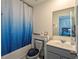 Well-lit bathroom with a tub shower combination, toilet, and sink at 3469 English Elm Way, Loganville, GA 30052